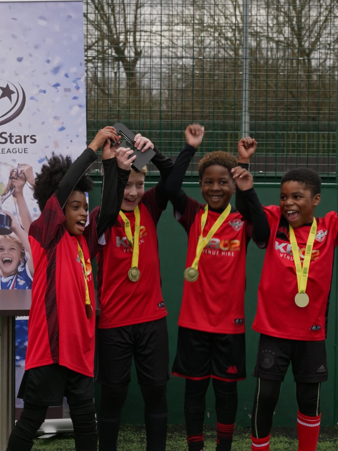 Diverse young players in action during 3-a-side football match